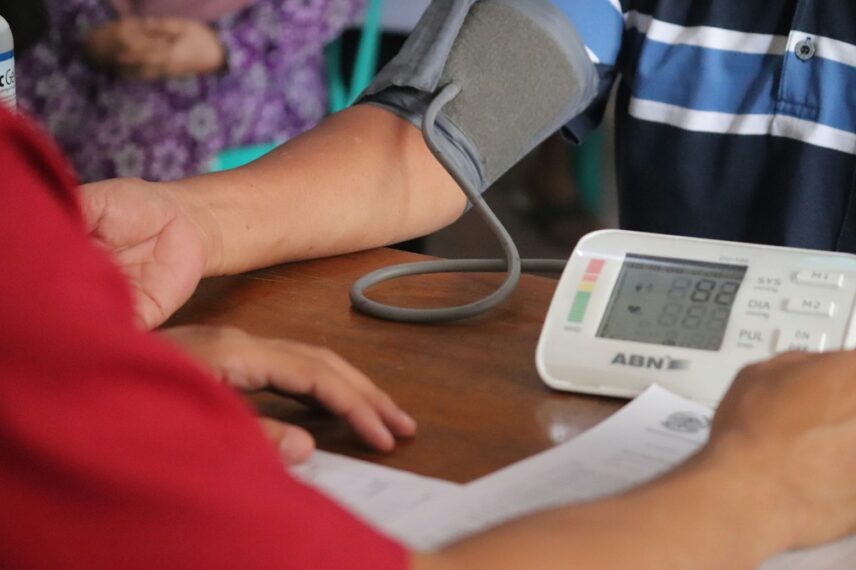 Nurse checking patient blood pressure at Binfield Road Surgery, NHS GP in Stockwell